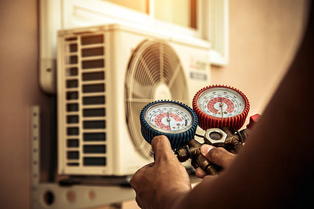Professional Air Conditioning Service technician working in Farmersville, CA